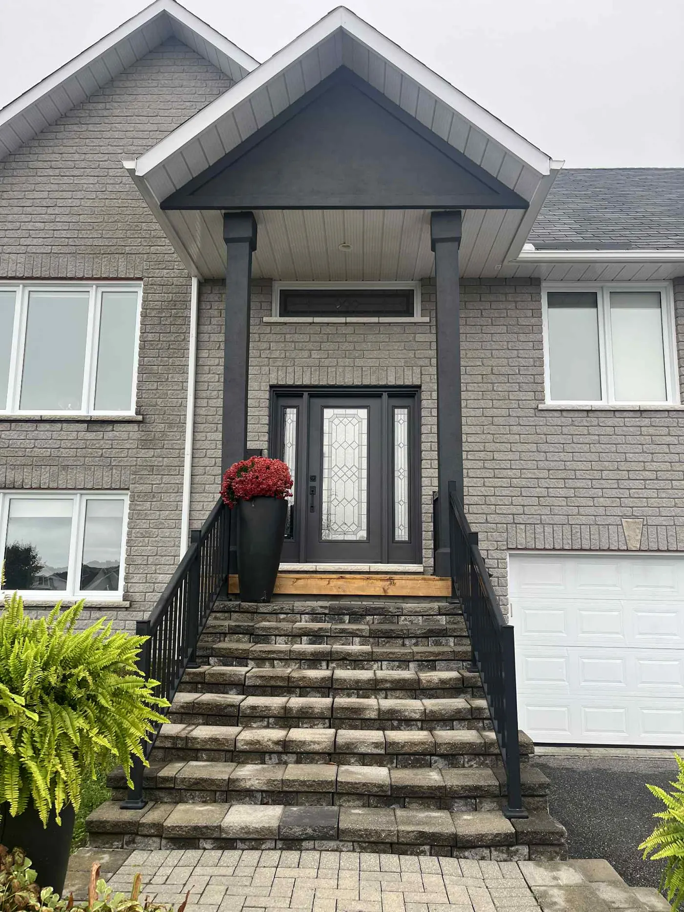 North Bay two-storey home after fresh exterior repaint by All In One Painting