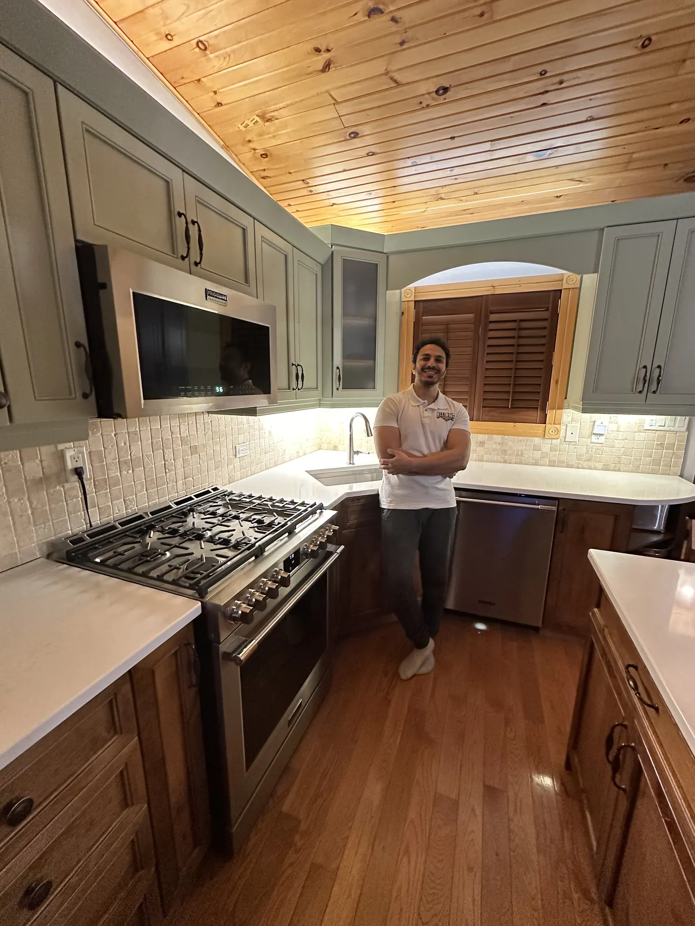 Cabinet box faces and drawer fronts after a budget brush-and-roll job in North Bay