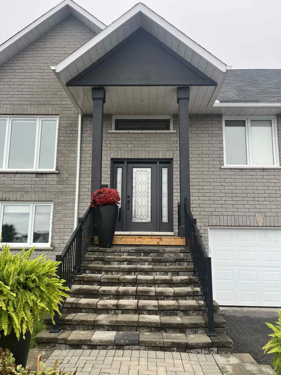 Same home with refreshed dark charcoal trim and columns